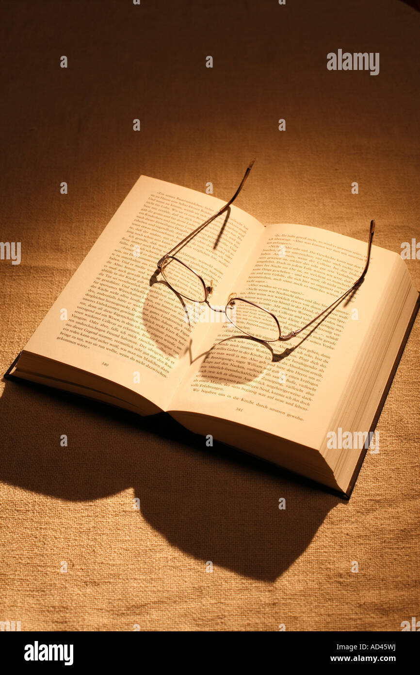Book with glasses Stock Photo
