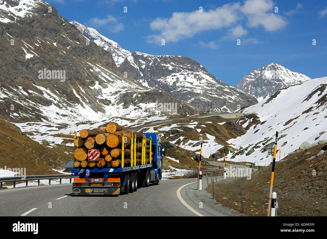 Truck transporting logs on the way up to the Julier Pass, Graubuenden, Grisons, Switzerland Stock Photo