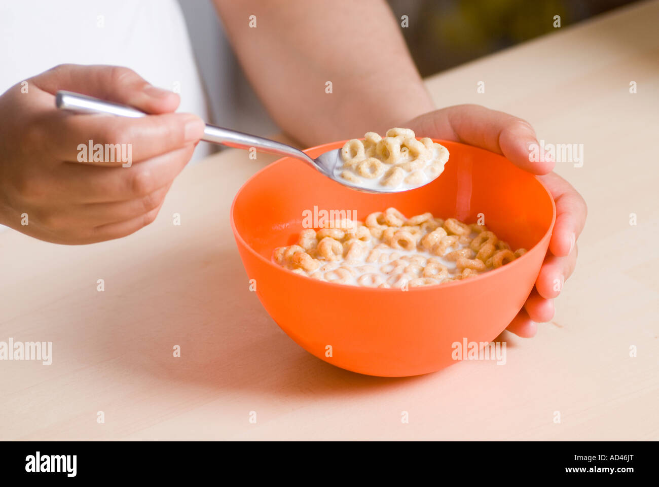 Woman eating cereal Stock Photo Alamy