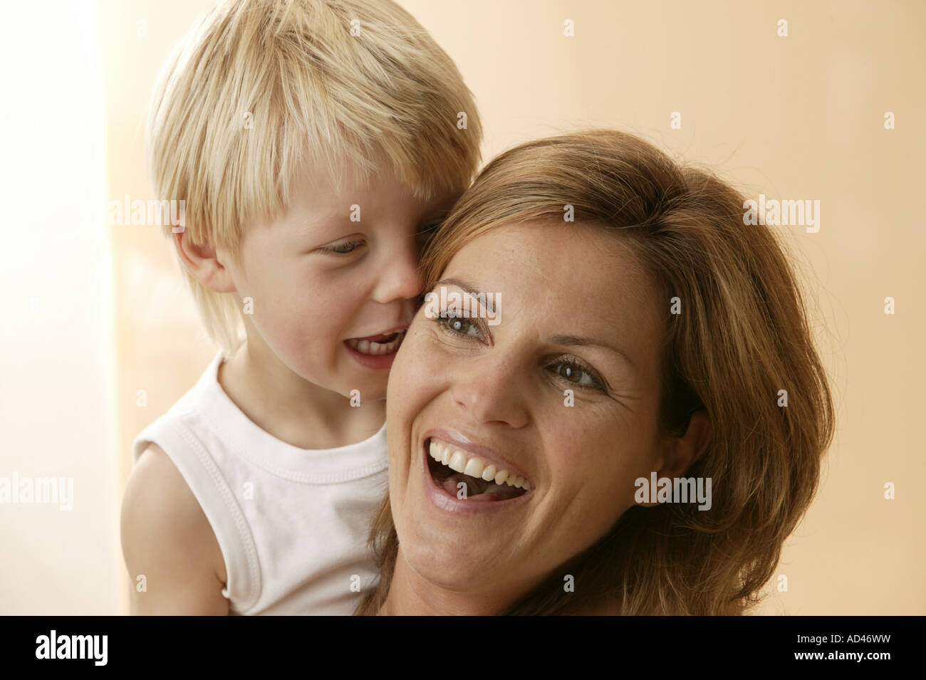 Lmother and little boy telling a joke Stock Photo