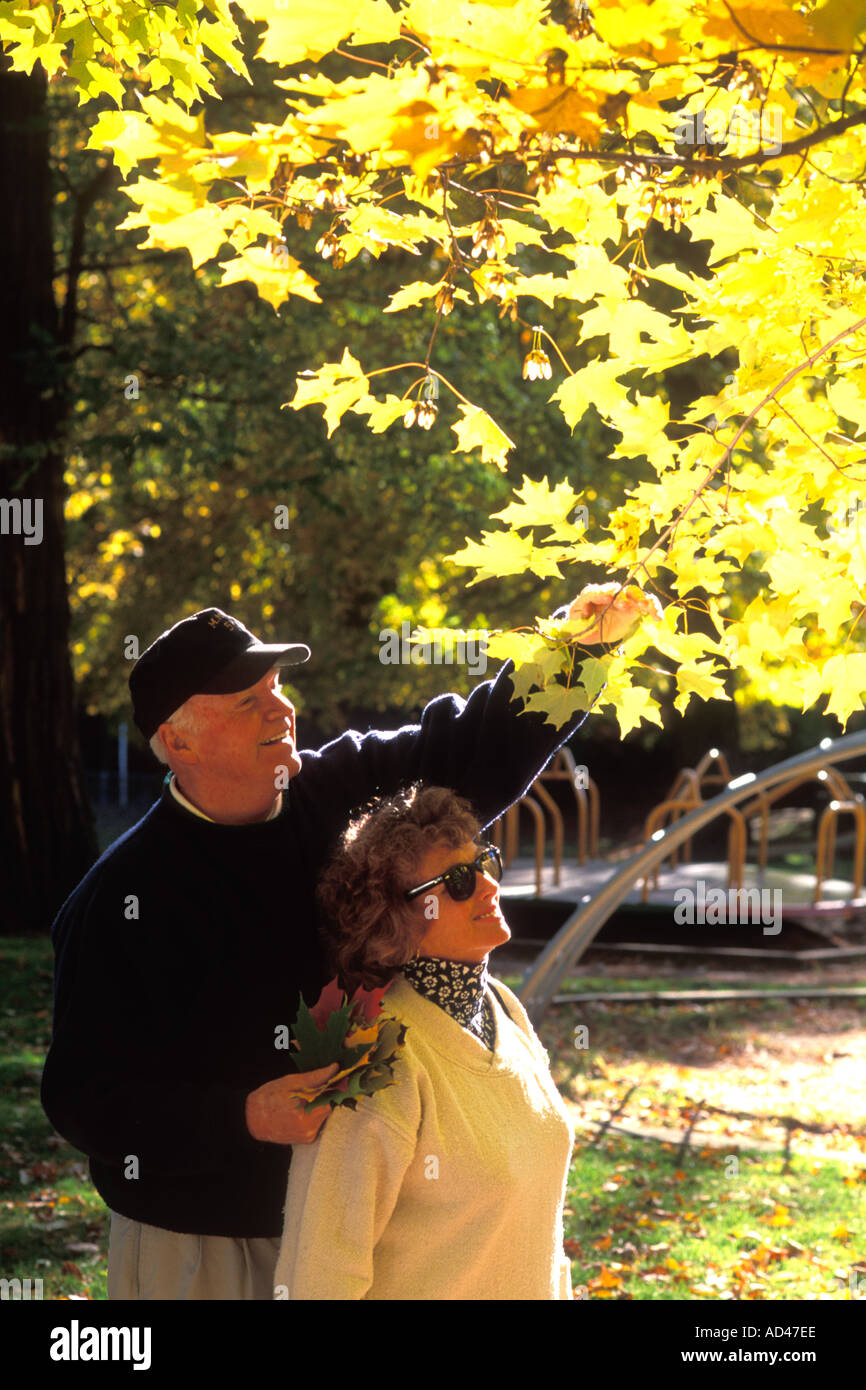 Middle aged couple walking in the woods Stock Photo - Alamy