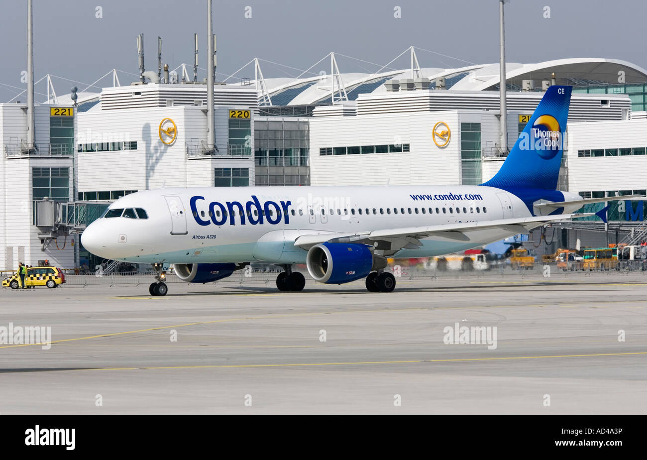 An Airbus A320 - 212 typed aircraft of Condor taxies at Munich Airport, Bavaria, Germany Stock Photo