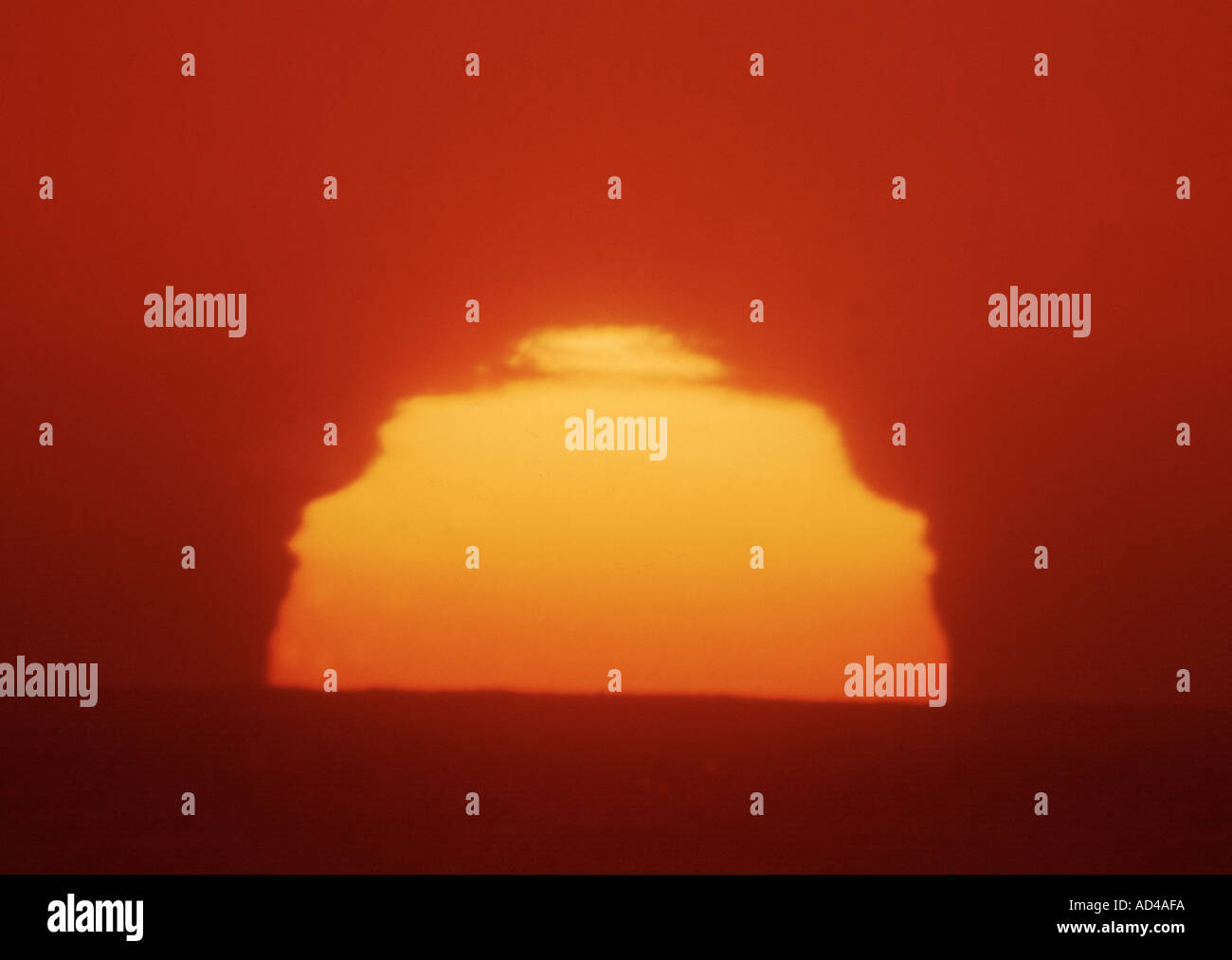 huge setting sun photographed through a telescope Stock Photo