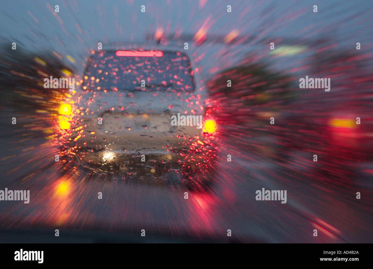 car speeding at stop light during heavy rain storm Stock Photo Alamy