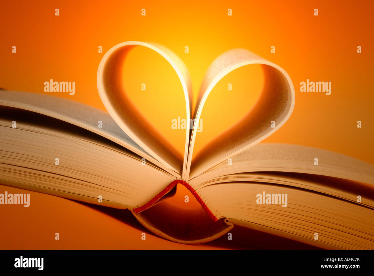 Open book in heart shape Stock Photo
