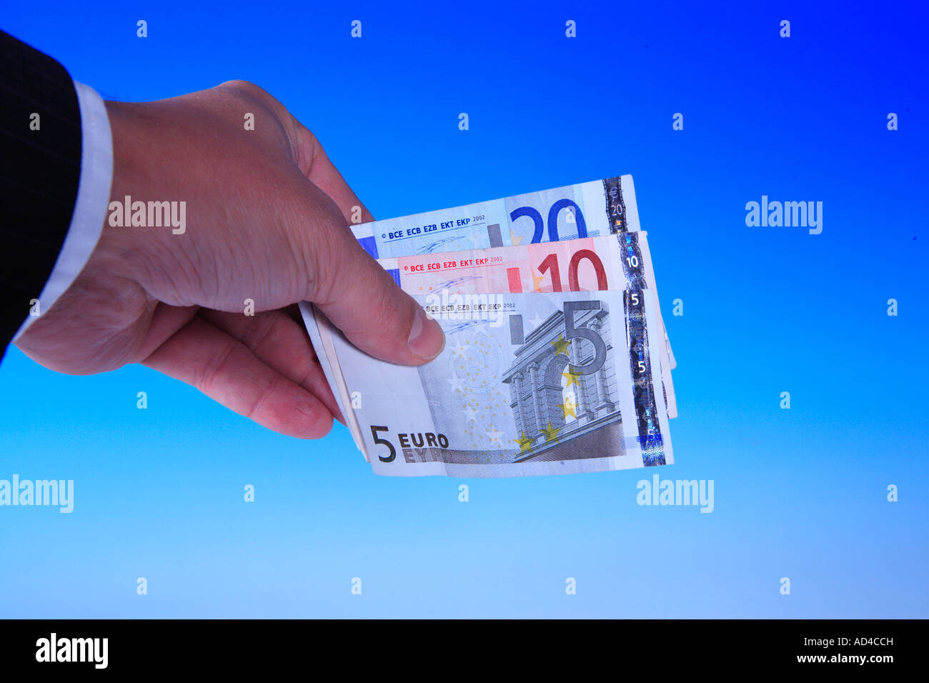Hand holds euro banknotes Stock Photo