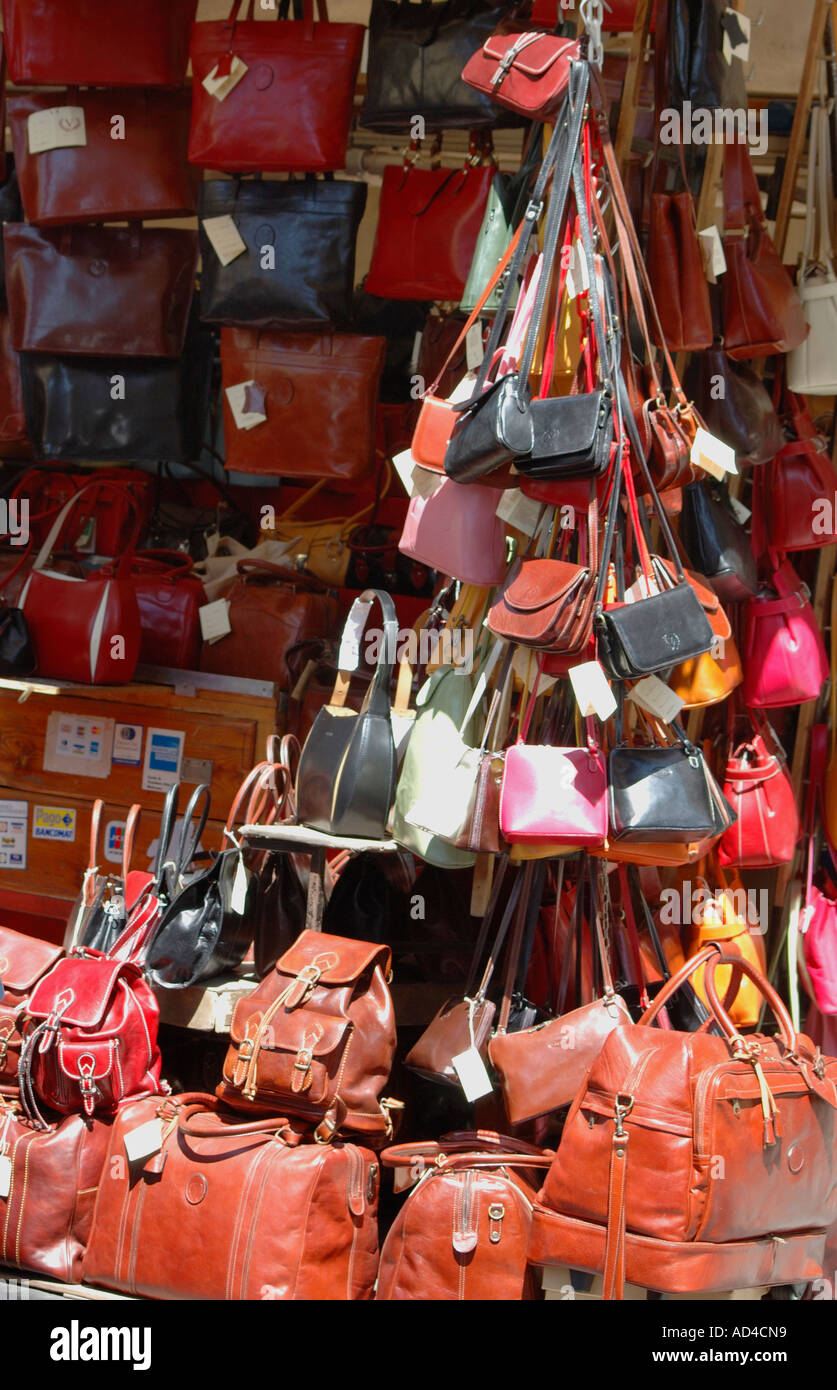 Leather bags on sale at a street corner Florence Italy Stock Photo - Alamy
