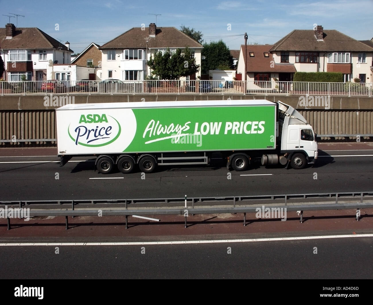 Houses close to A12 dual carriageway trunk road with heavy noisy hgv lorry traffic Stock Photo