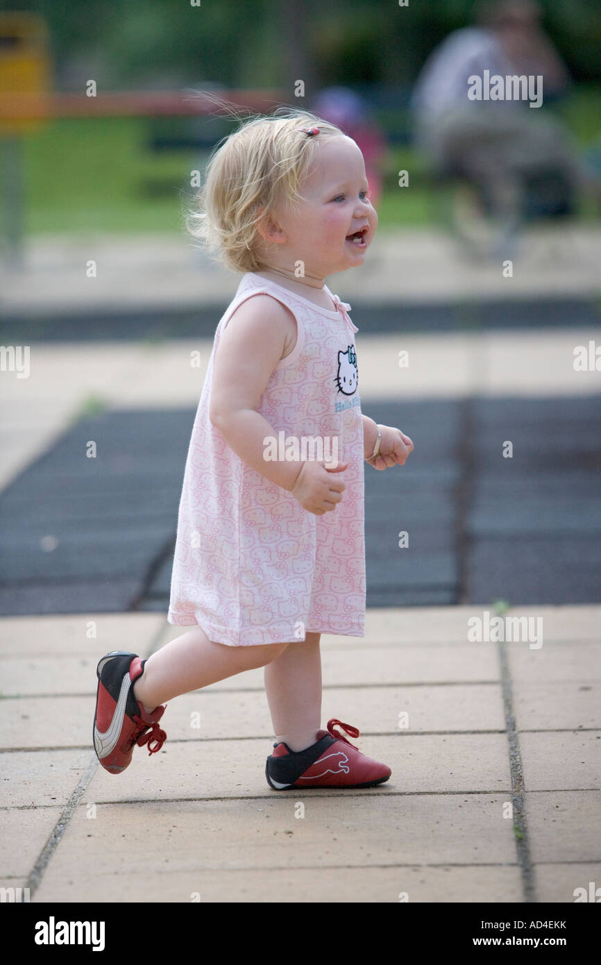 Walking little girl Stock Photo - Alamy