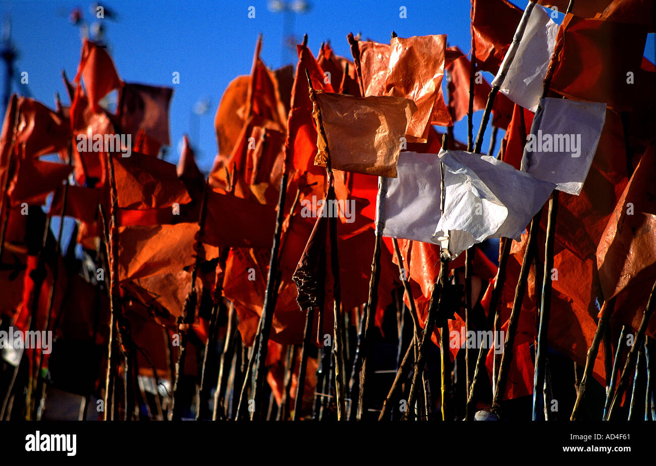 flags attached to floats for fishing nets flutter in the breeze on the harbour at Essaouira Morocco Stock Photo