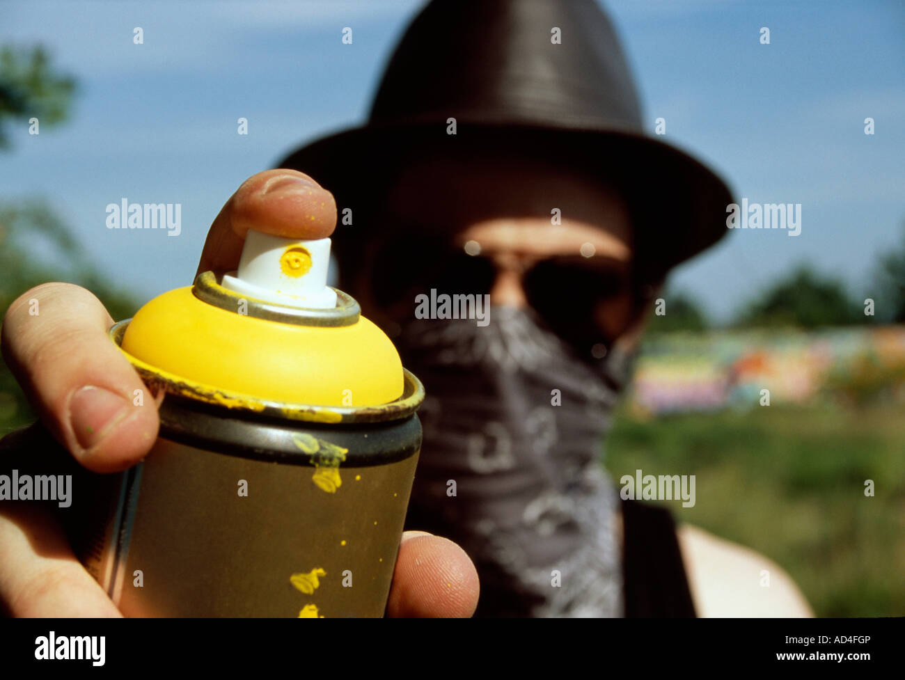 A man holding a can of spray paint Stock Photo