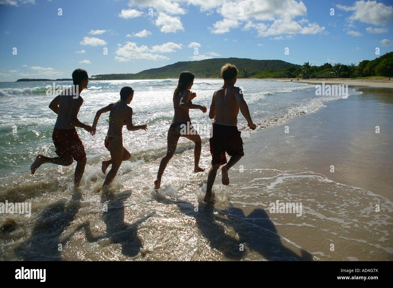Young people having fun on the beach Stock Photo - Alamy