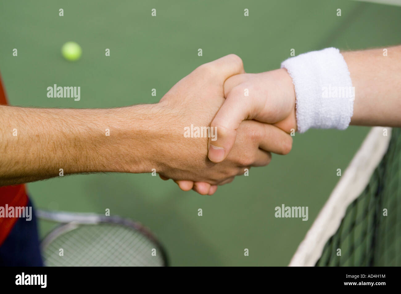 Two tennis players shaking hands Stock Photo