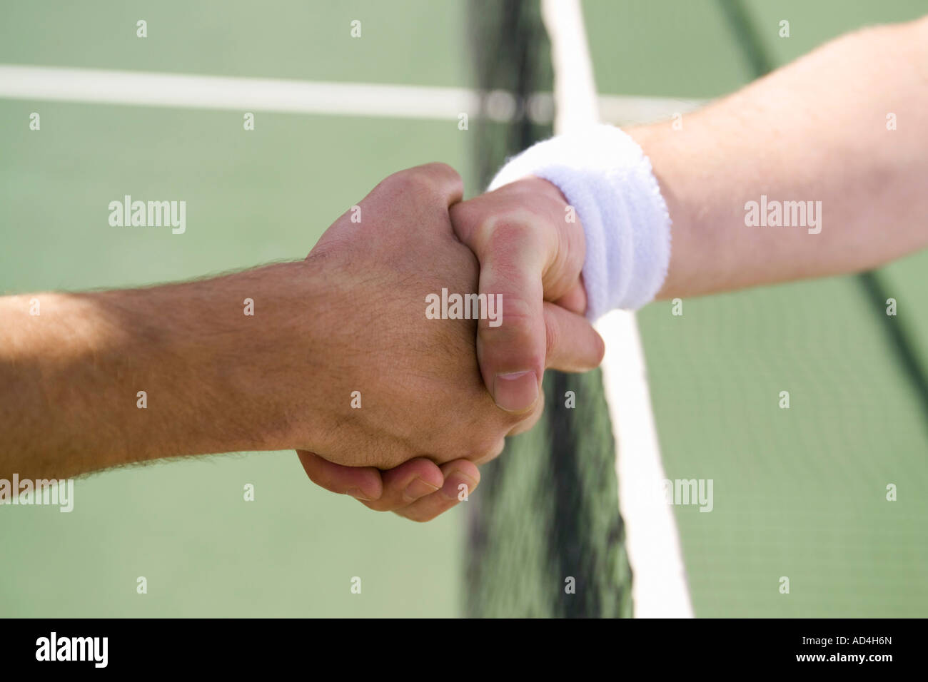 Two tennis players shaking hands Stock Photo