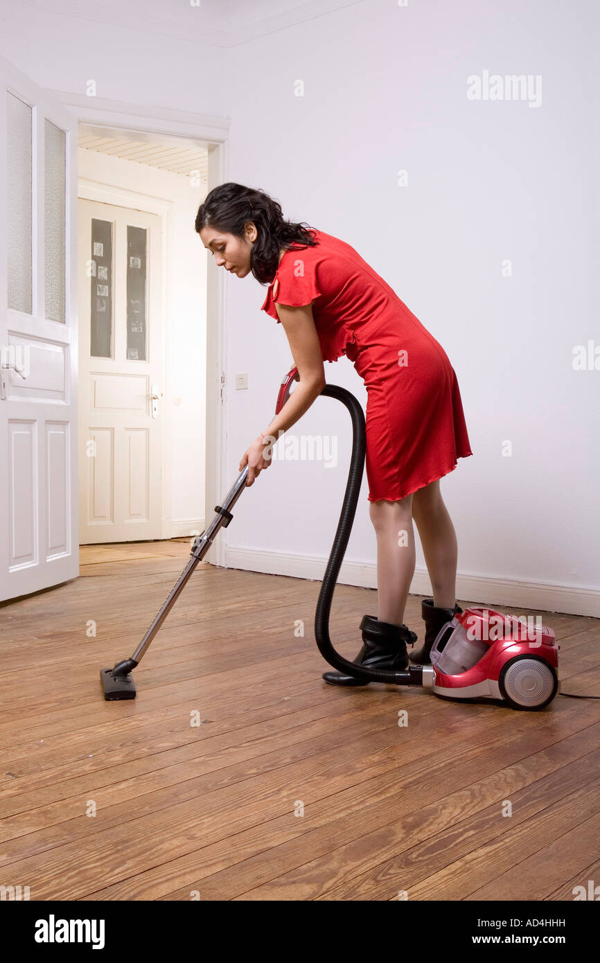 A woman vacuuming Stock Photo