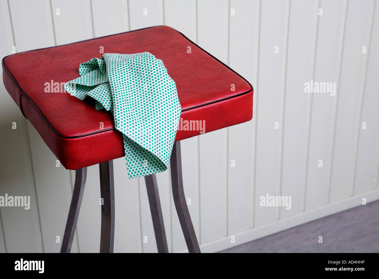 A cleaning cloth on a stool Stock Photo