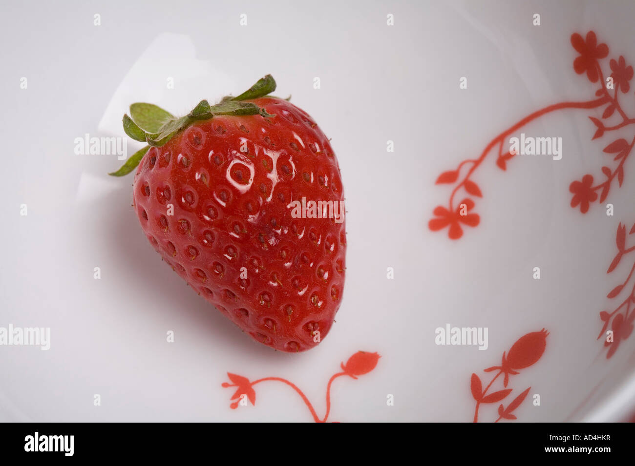 A strawberry in a bowl Stock Photo