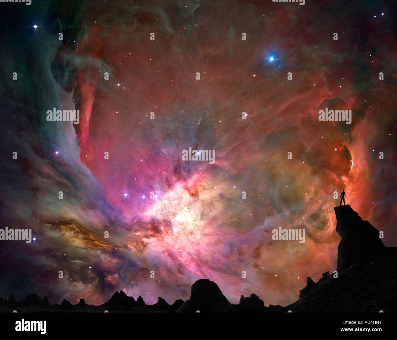 Man on Mountaintop viewing a Nebula Stock Photo