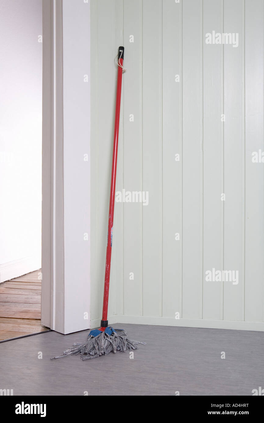 A mop in a corner Stock Photo
