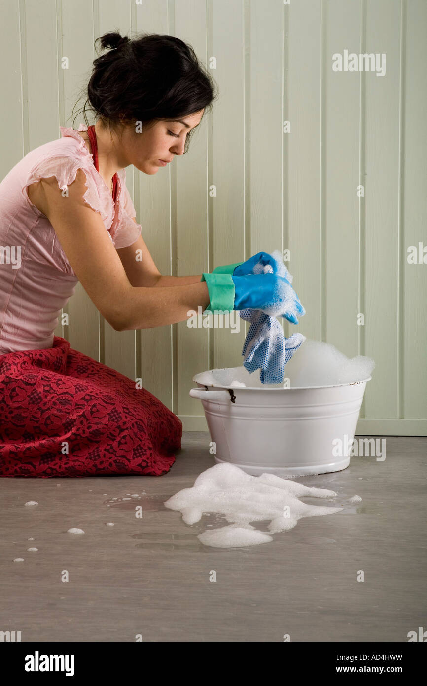 A woman cleaning the floor Stock Photo