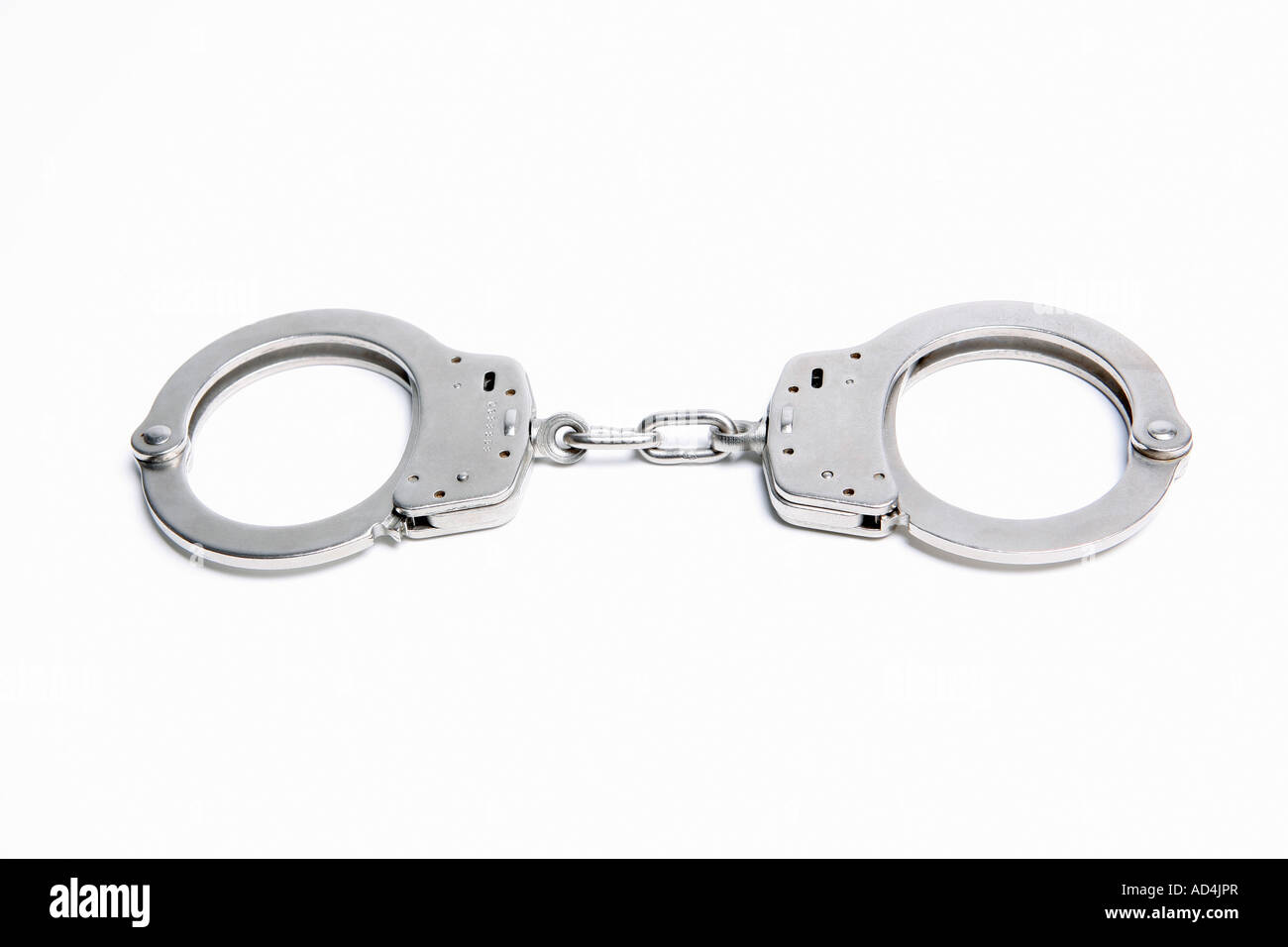 A pair of handcuffs Stock Photo - Alamy