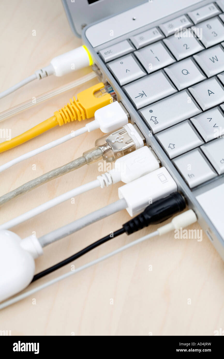 Cables connected to a laptop Stock Photo