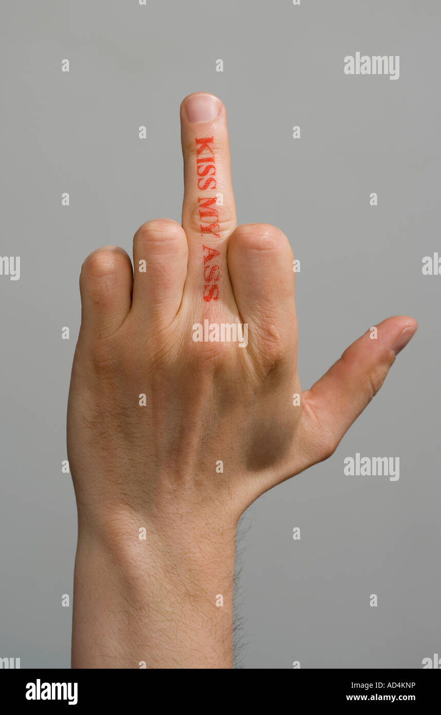 A man with a rubber stamp on his middle finger making an obscene hand gesture Stock Photo