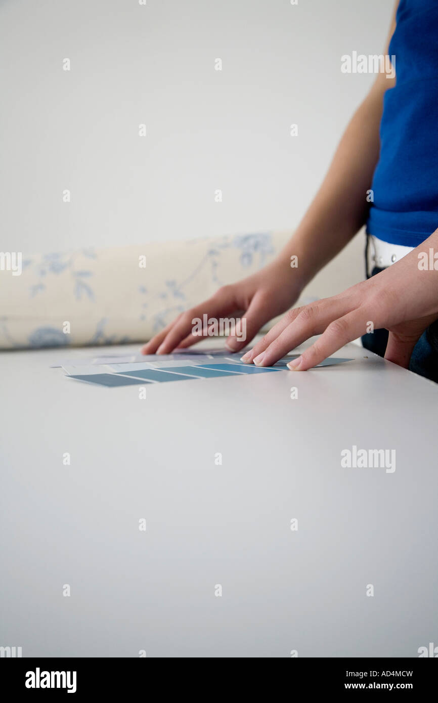 Woman comparing color samples Stock Photo - Alamy