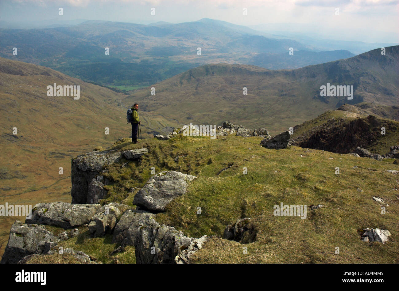 A lone climber pauses on the south ridge of Snowdon Stock Photo