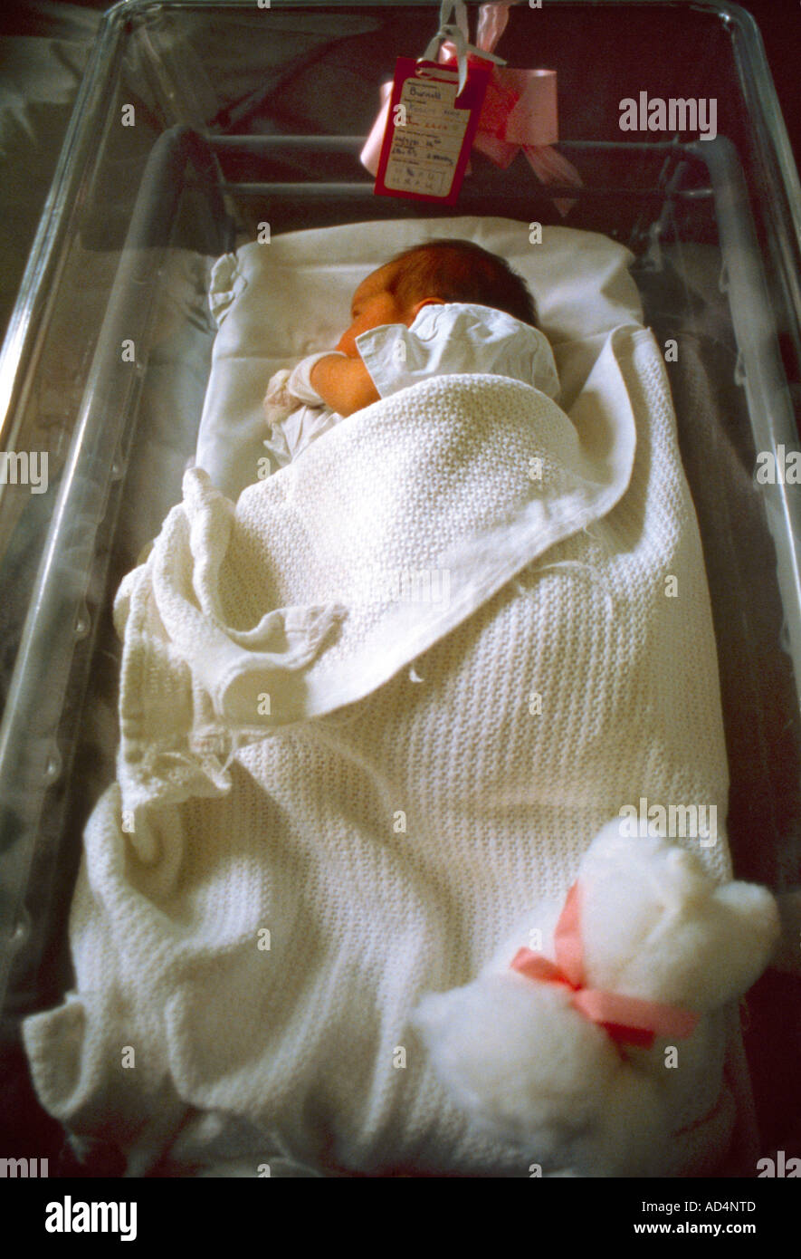 New Born Baby Sleeping on Side in Cot Stock Photo Alamy