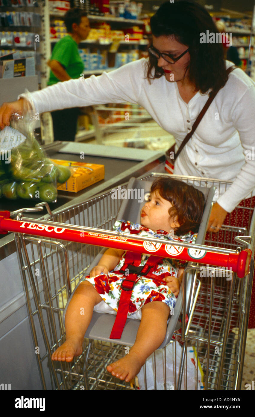 Baby In Trolley At Checkout Tescos Supermarket Stock Photo Alamy