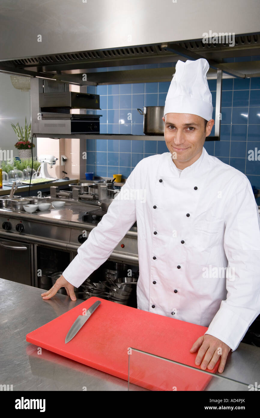 A chef in a commercial kitchen Stock Photo