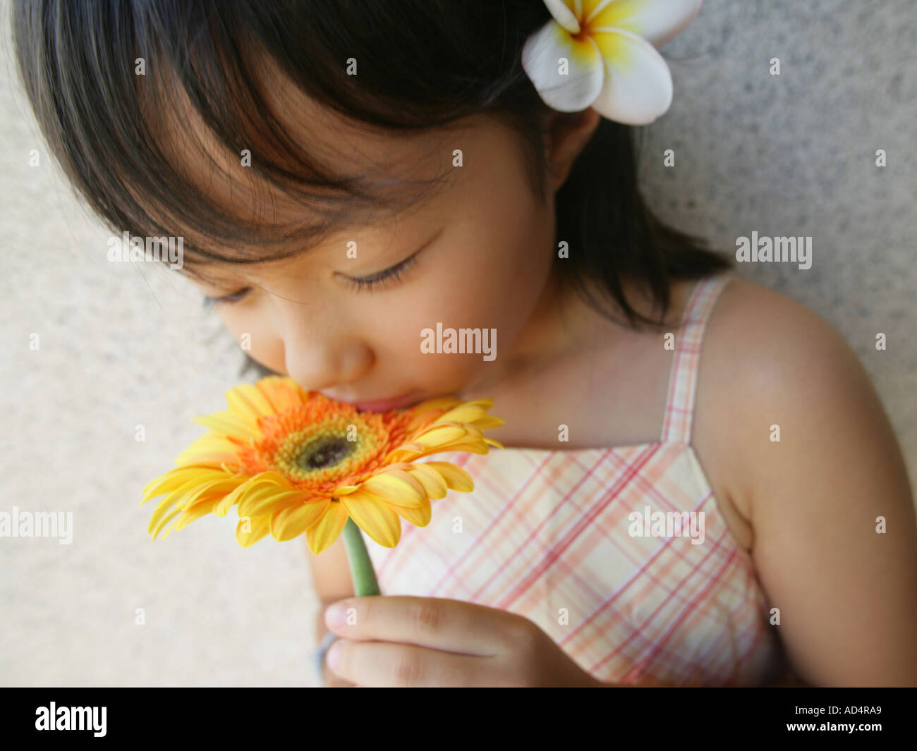 Black child smelling flower hi-res stock photography and images - Alamy