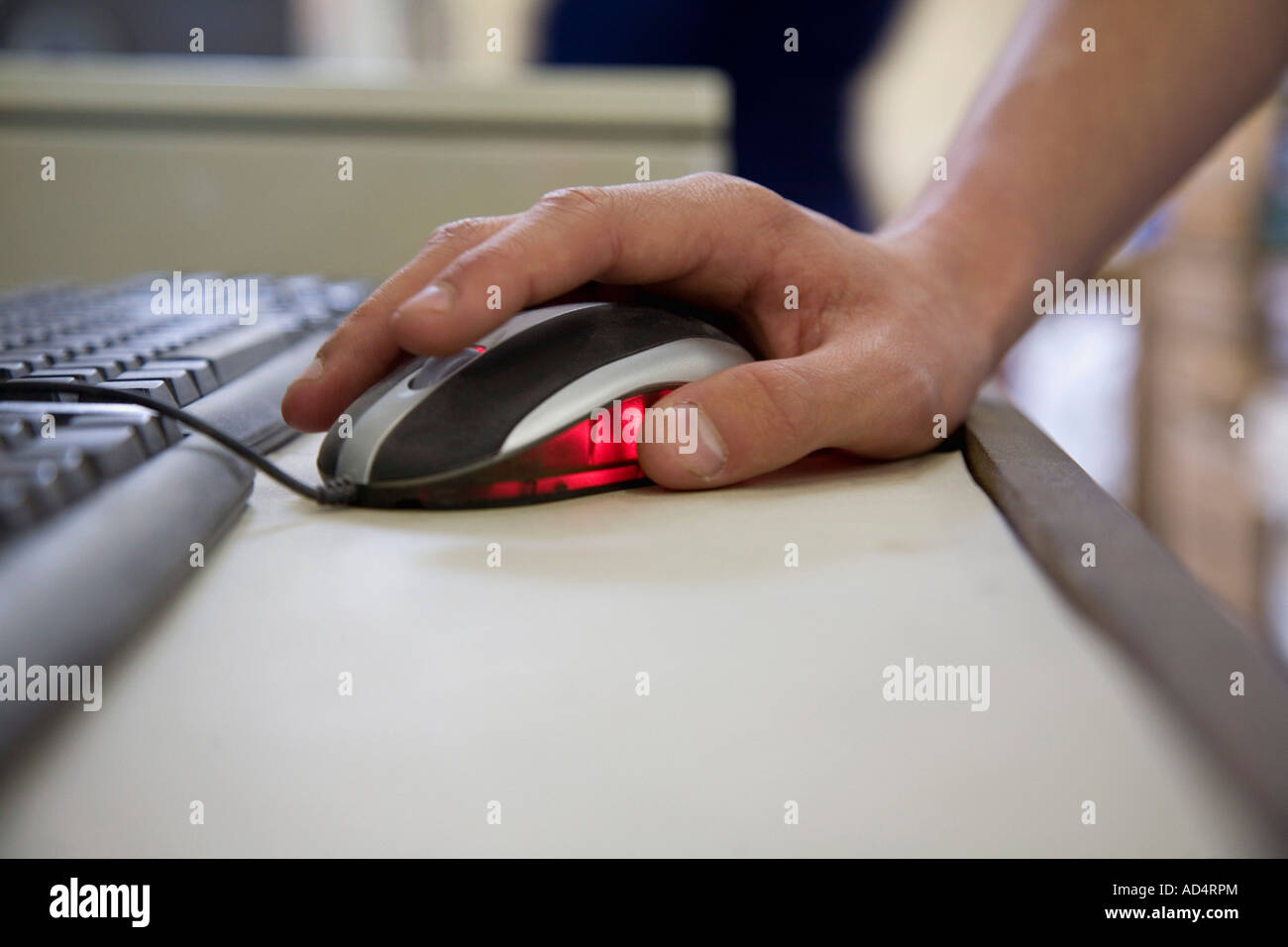 Detail of a man using a computer mouse Stock Photo - Alamy