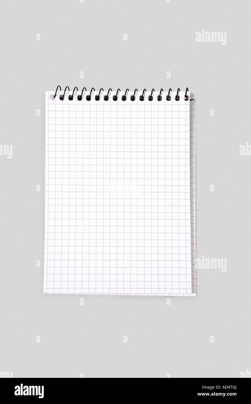 A spiral notebook with grid paper Stock Photo