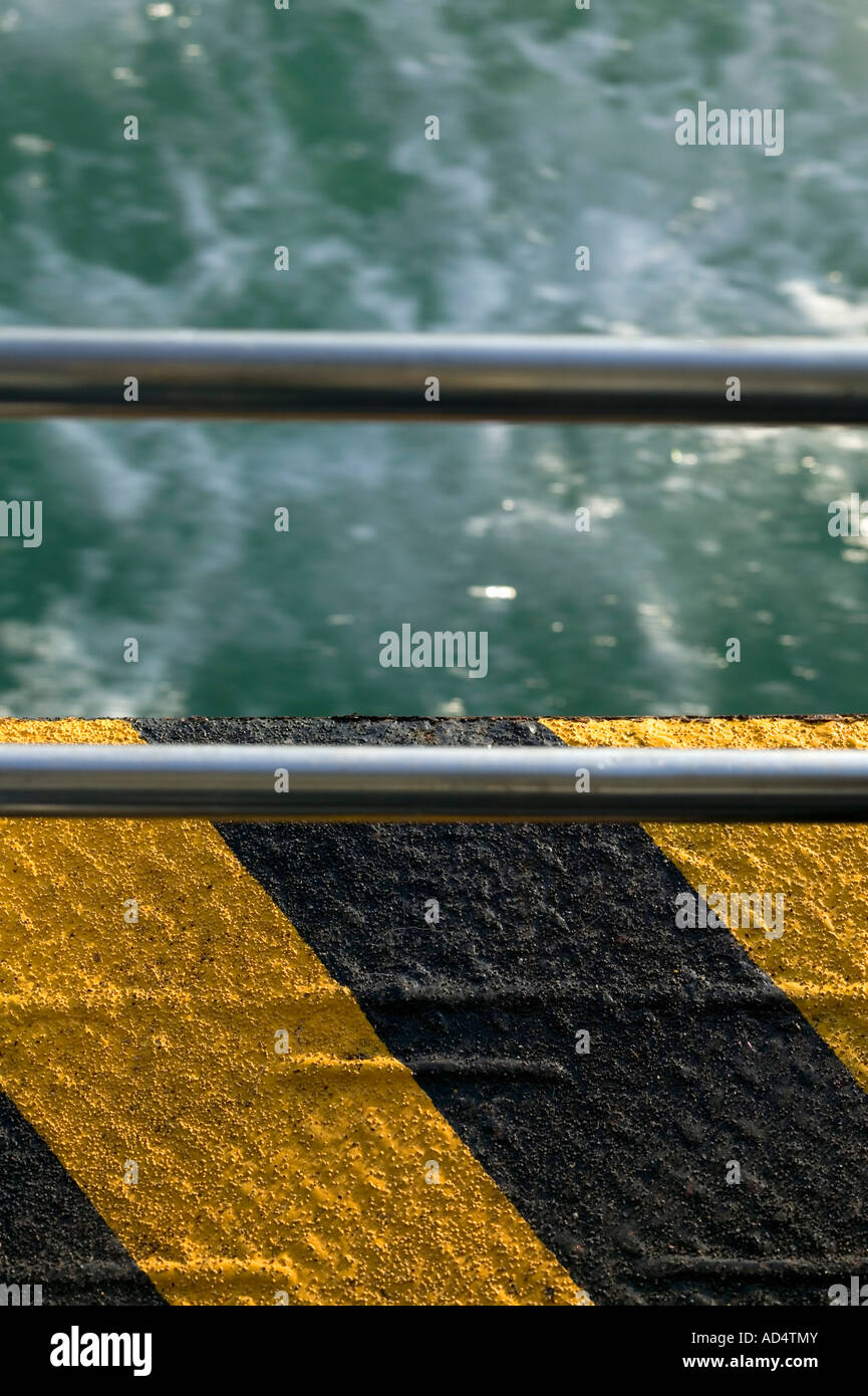 Handrail at edge of water Stock Photo