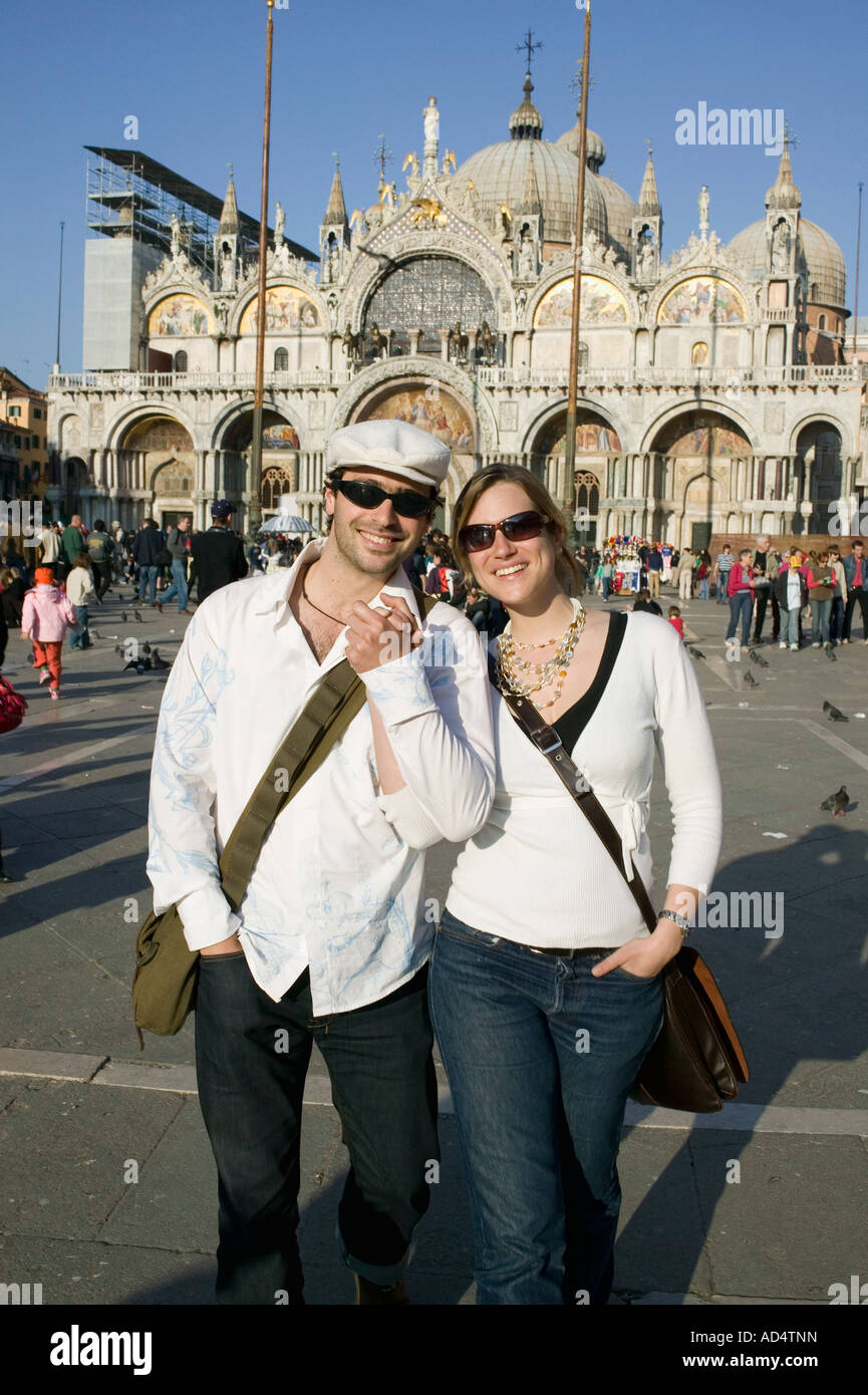 Couple in front of St Mark's Cathedral, Venice Stock Photo