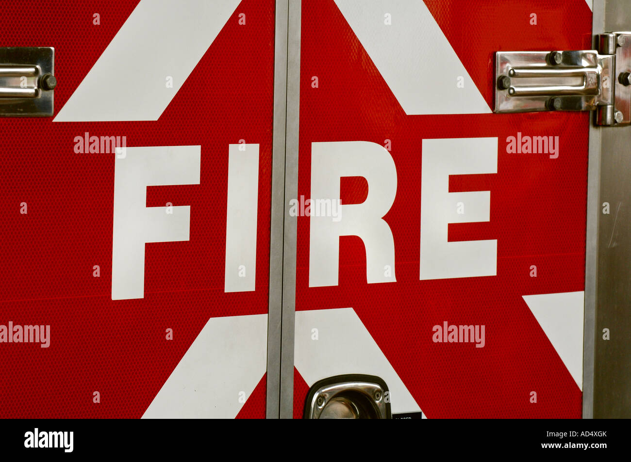 An emergency services vehicle with the word FIRE in reflective lettering on the back of the appliance. Picture by Jim Holden. Stock Photo