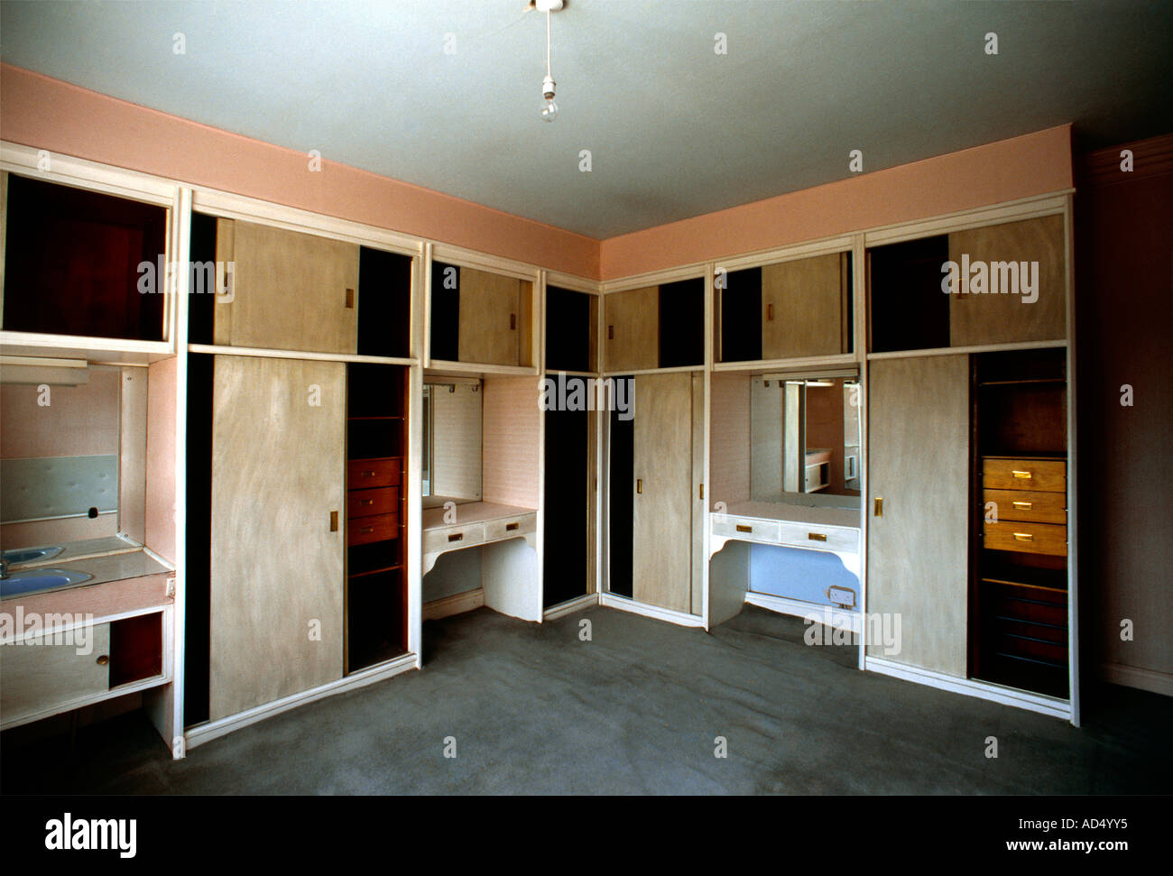 Empty Bedroom With Cupboards And Wardrobes Stock Photo