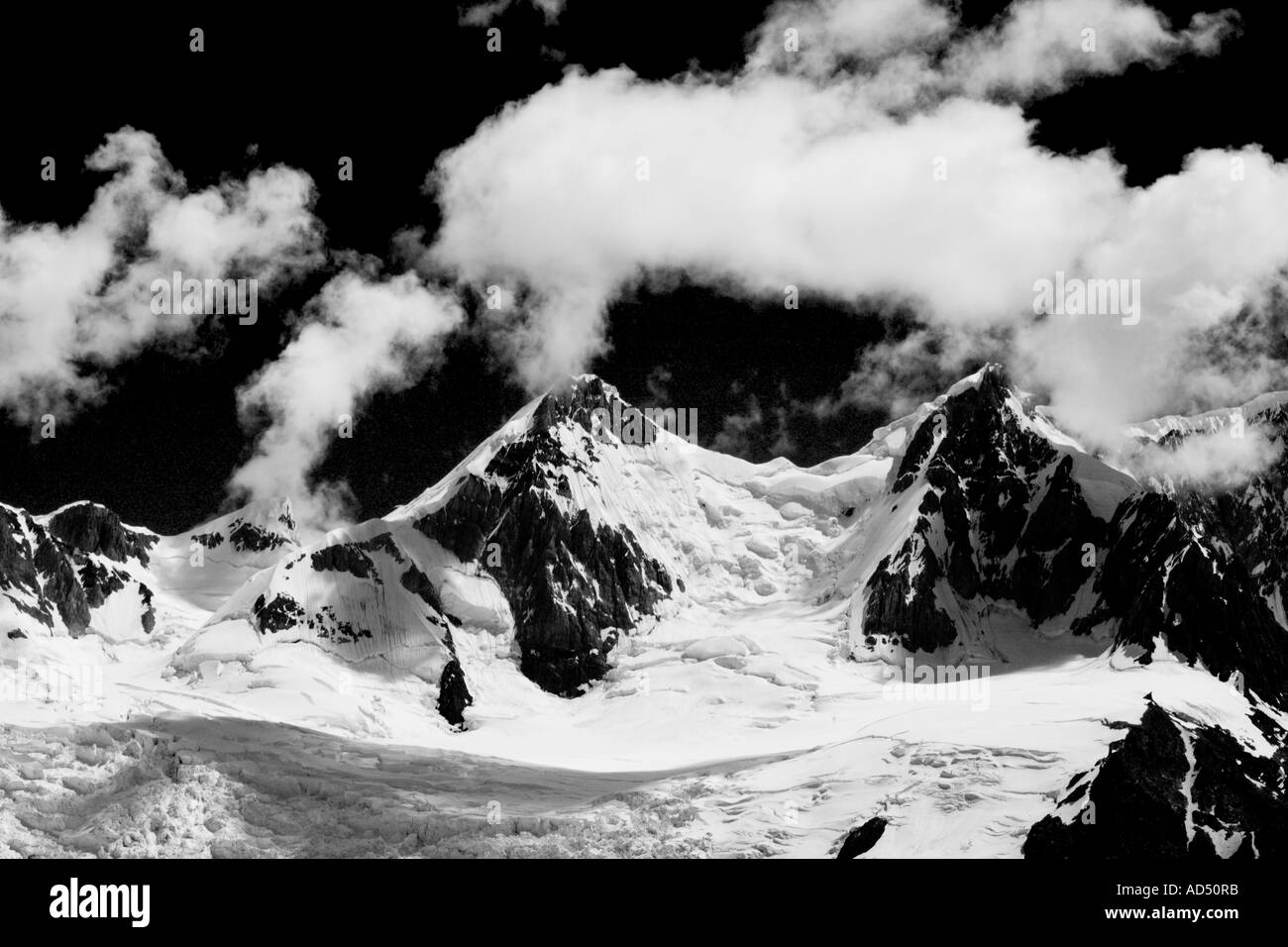 Wisps of clouds off peaks glacier torres Stock Photo