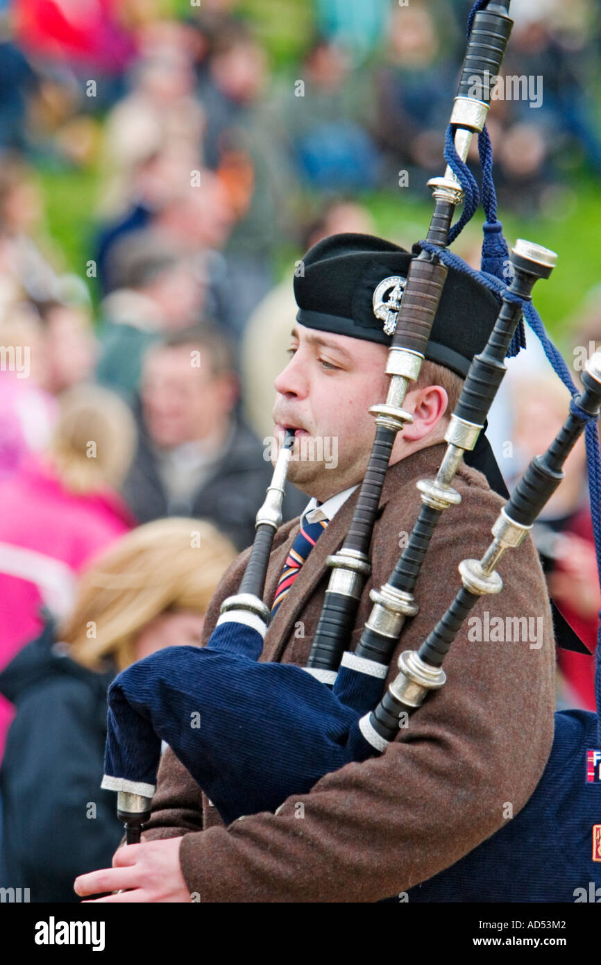 Scottish piper playing bagpipes at 2006 Atholl Gathering Highland Games