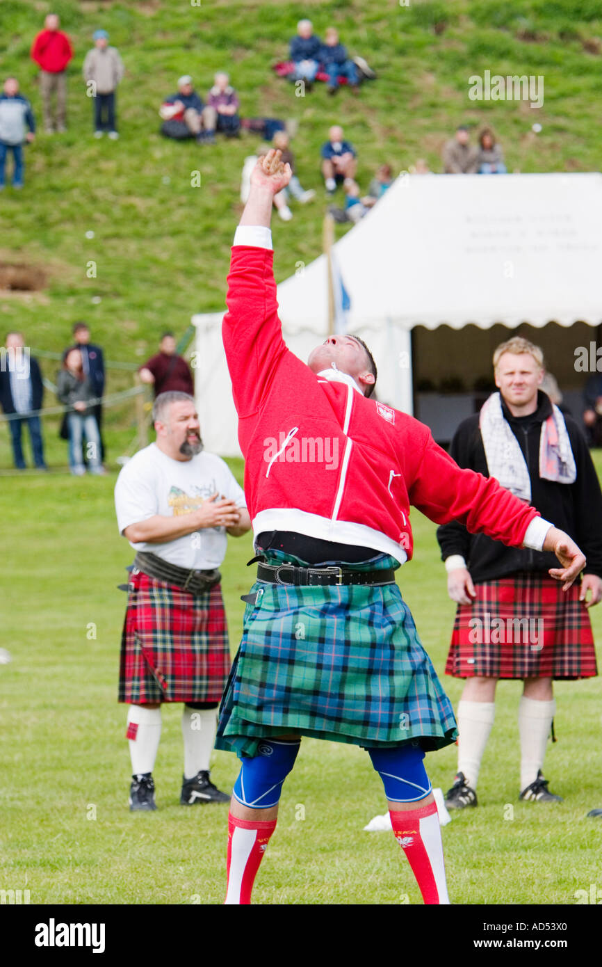 Sebastian Wenta throwing heavy weight over high bar at 2006 Atholl ...