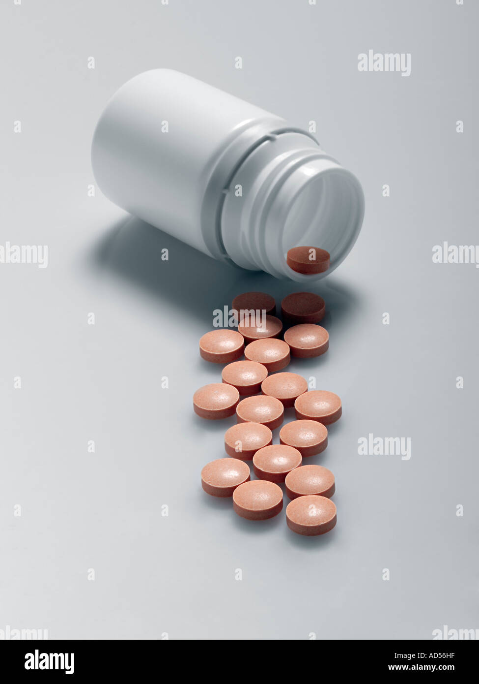 Pills spilling out of bottle Stock Photo Alamy