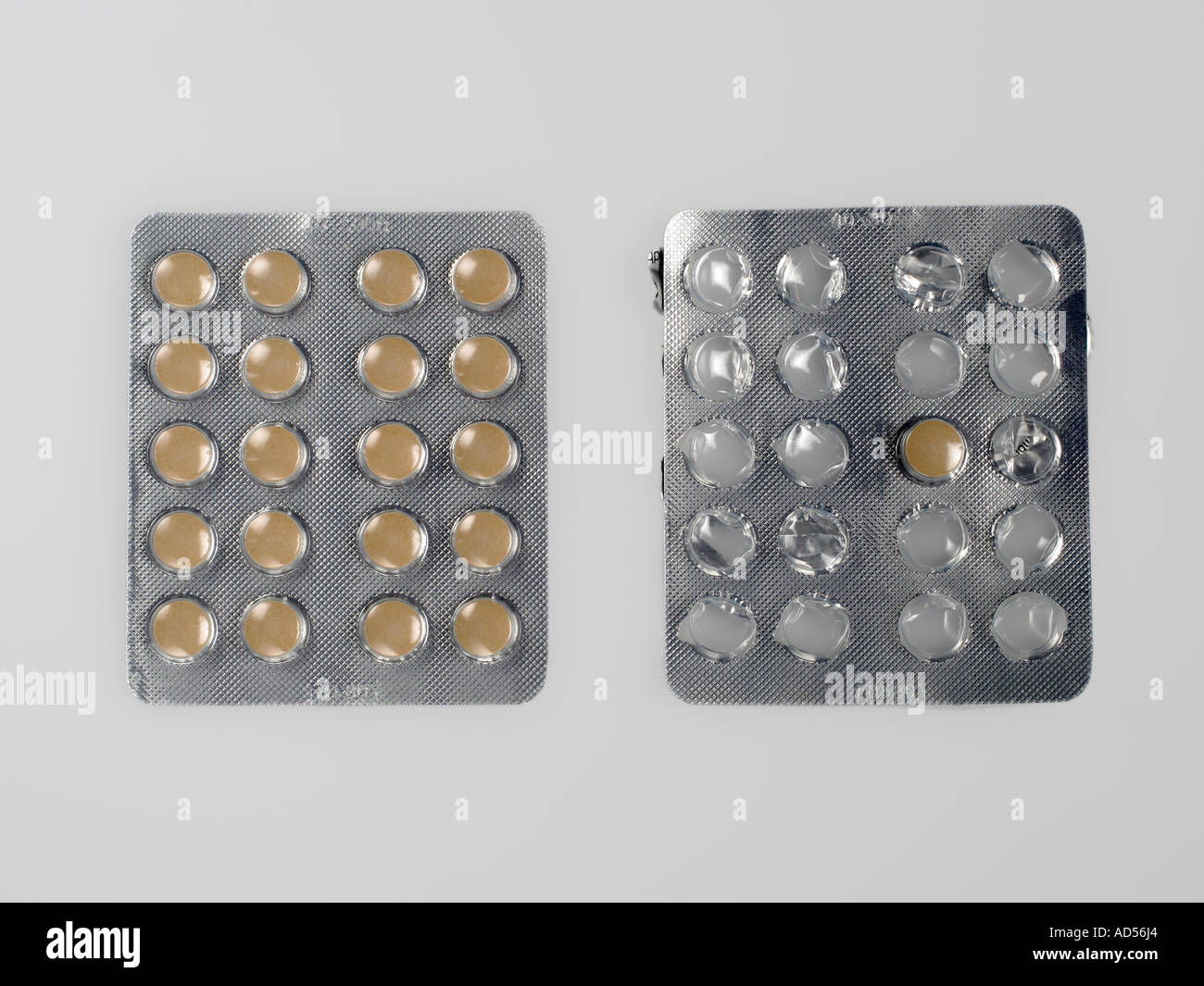 Full and almost empty blister pack with tablets side by side Stock Photo
