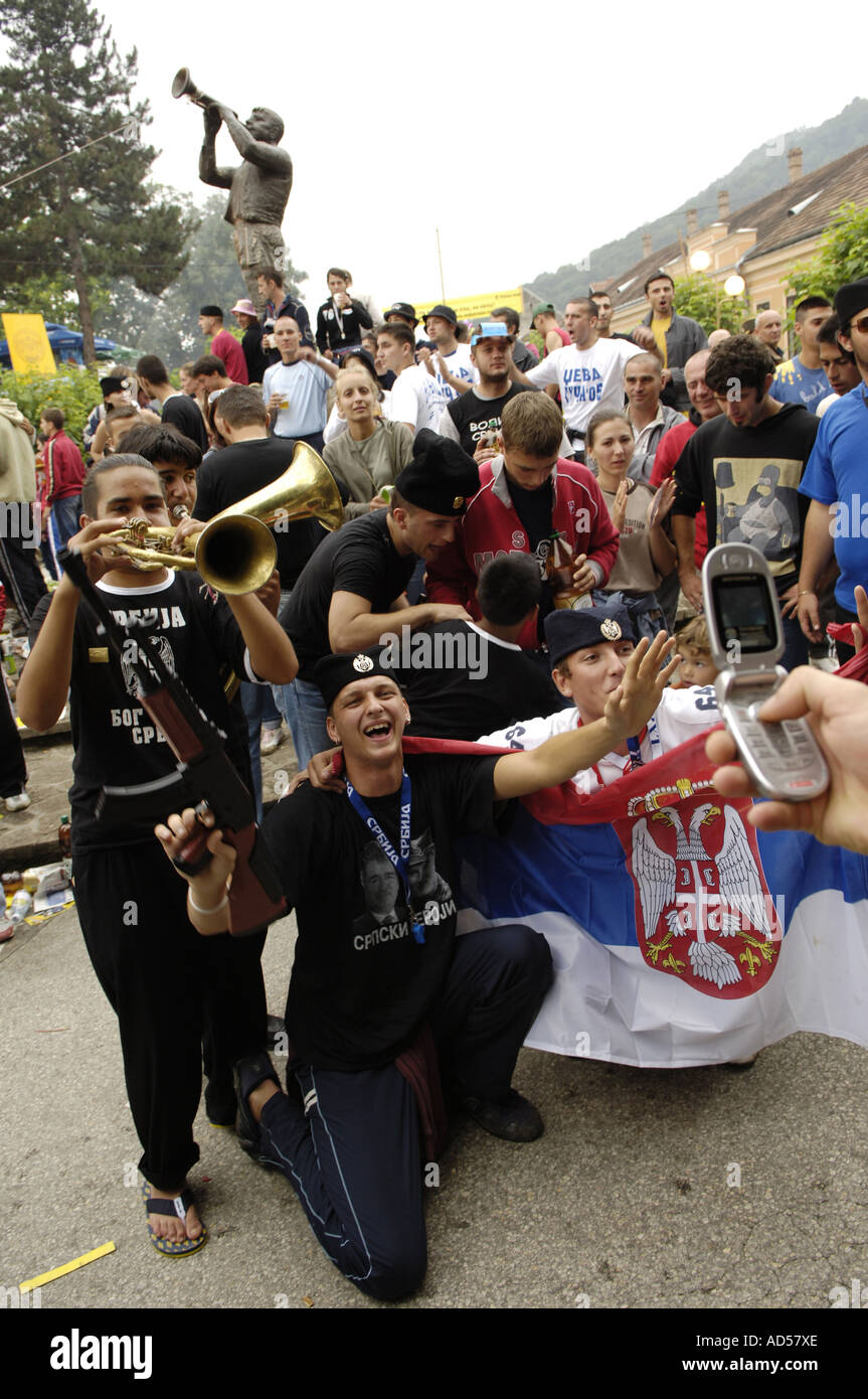 Balkan Brass Bands Music Festival Guca / Serbia 2005, men posing with Serbian flag Stock Photo