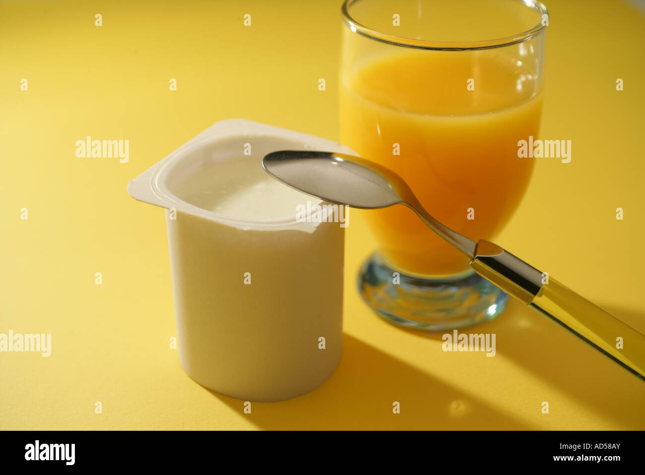 Yoghurt and glass of juice Stock Photo Alamy