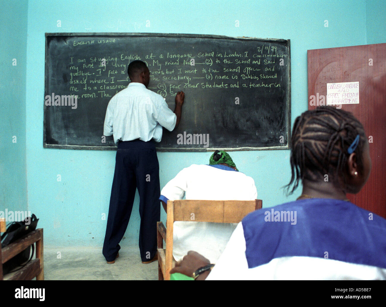 Teacher during an English language lesson at a school in The Gambia ...