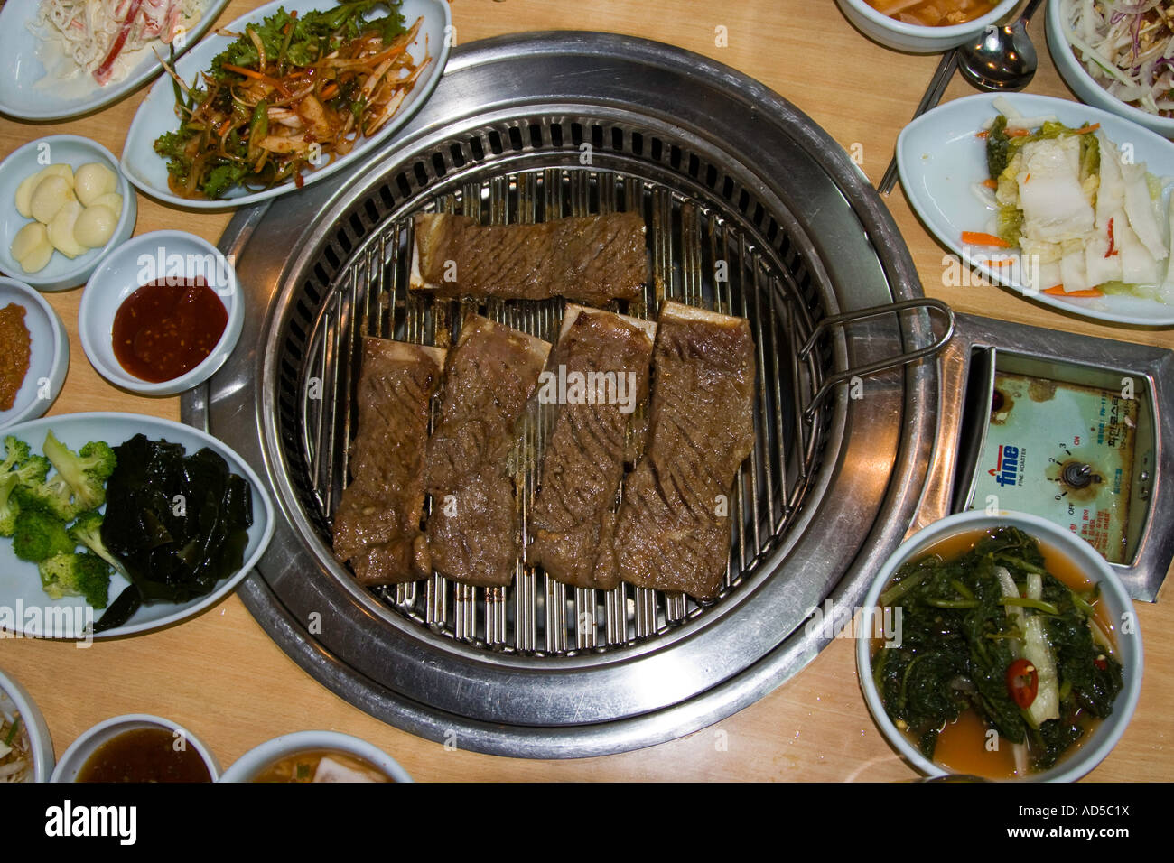 Kalbi or Galbi Beef Short Ribs Grilling on the BBQ at a Korean Galbi House Seoul South Korea Stock Photo