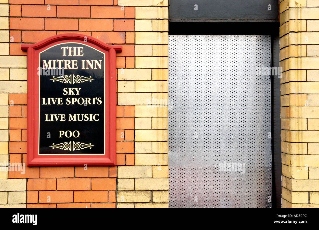 Boarded up Mitre Inn pub with defaced sign in Abertillery Blaenau Gwent South Wales Valleys UK Stock Photo