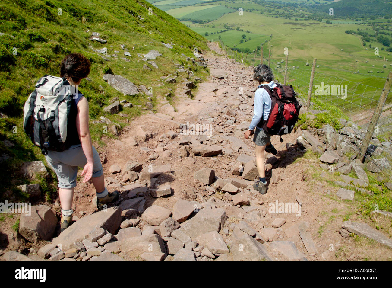 Woman Walking Up Steep Hill High Resolution Stock Photography and
